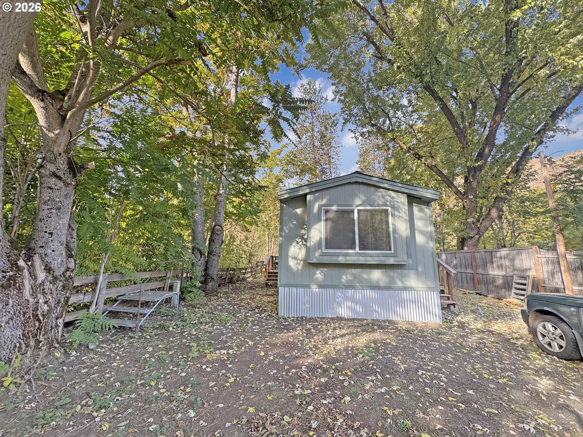 53945 Highway 86 Halfway, OR 97834 - Photo 2 of 48 a front view of a house with garden