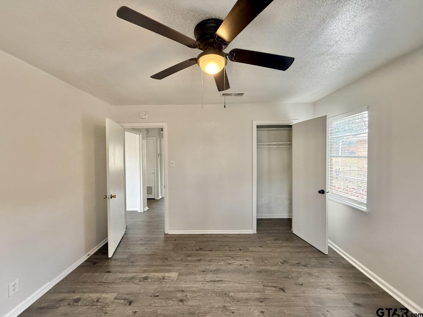 533 Bandera Drive Tyler, TX 75702 - Photo 11 of 18 a view of empty room with wooden floor
