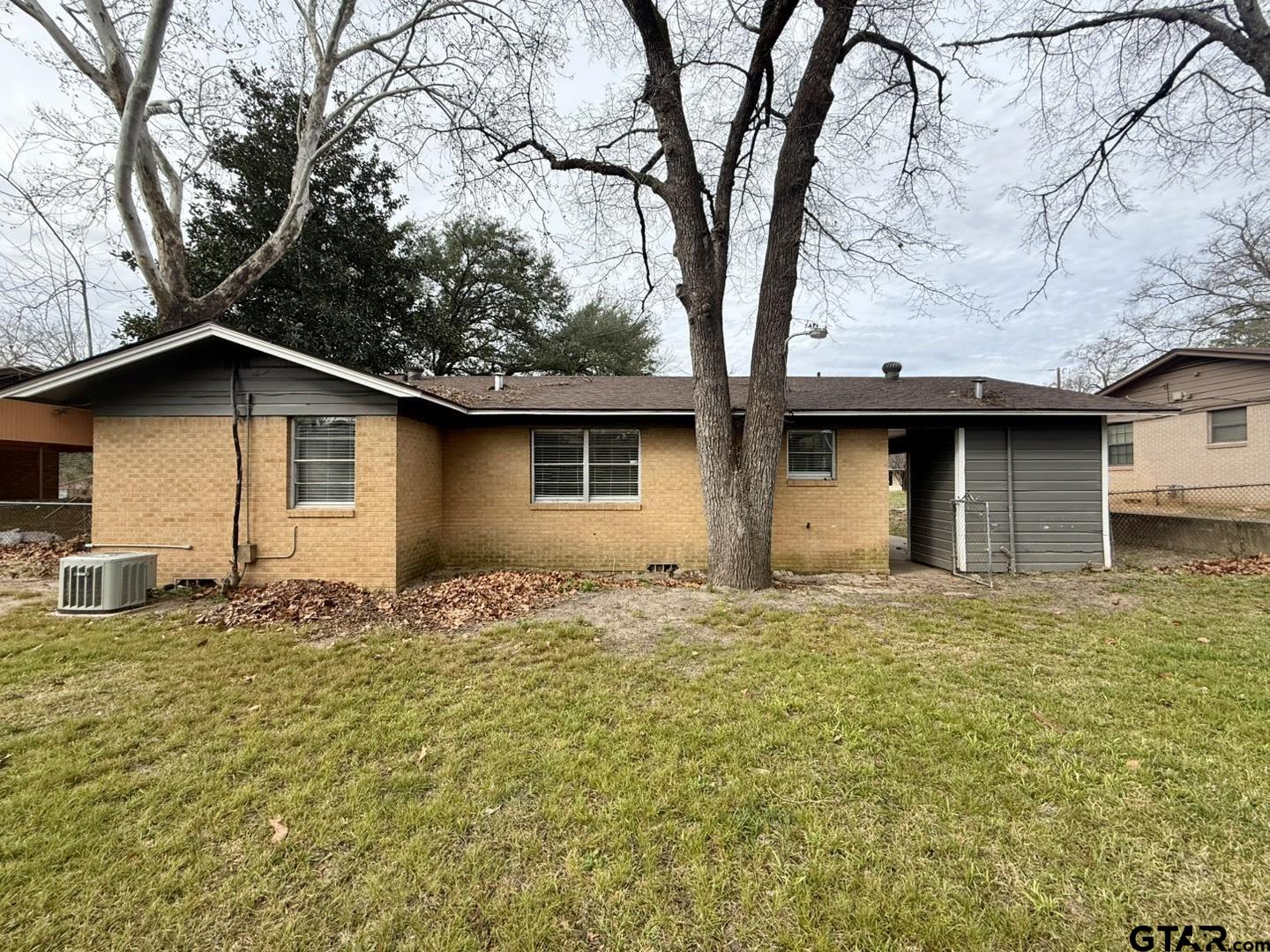 533 Bandera Drive Tyler, TX 75702 - Photo 17 of 18 a house that has a tree in front of it