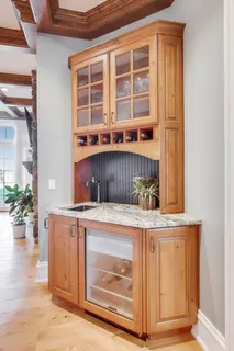 a bathroom with a granite countertop sink toilet a mirror a vanity a bath tub and shower