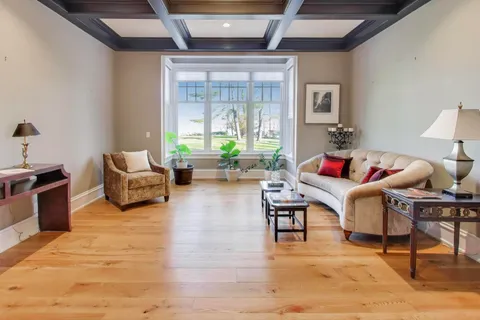 a bathroom with a granite countertop toilet a sink and mirror