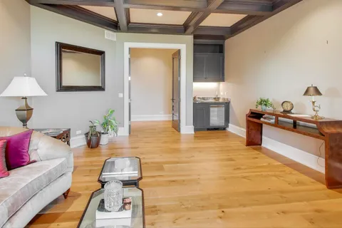 a front view of a house with a garden and garage