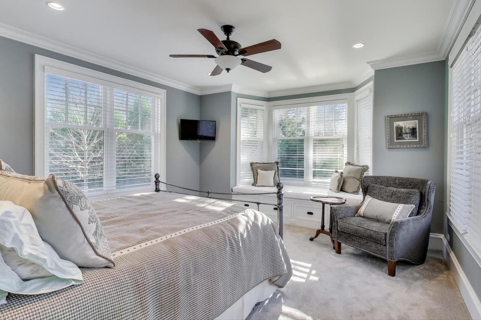 347 Bluffs Edge Drive Lake Forest, IL 60045 - Photo 28 of 79 a spacious bedroom with a bed a couch and a large window