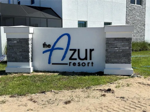 a sign that is sitting in front of a house