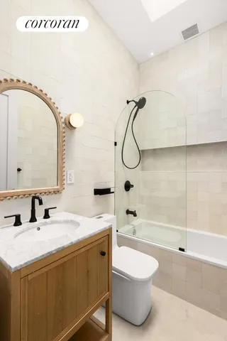 a bedroom with a bed and a desk