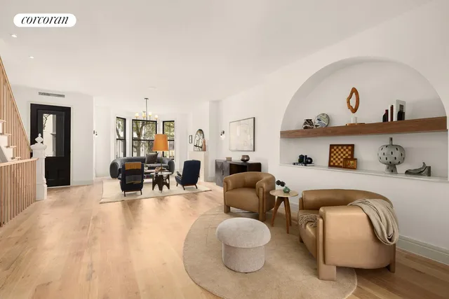 a living room with furniture fireplace and window