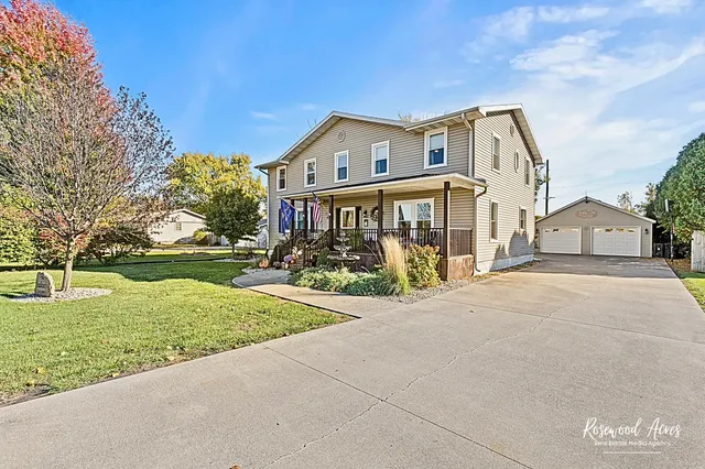 a front view of house with yard and green space