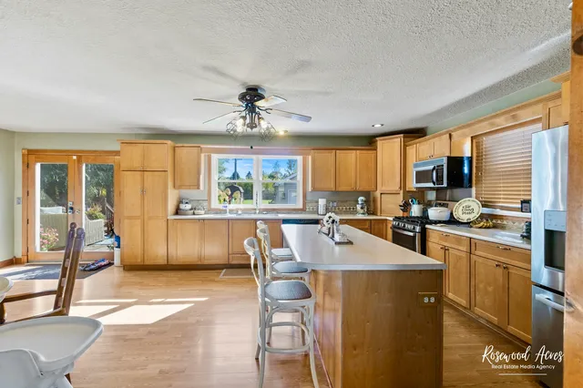 a bedroom with a bed and a wooden floor