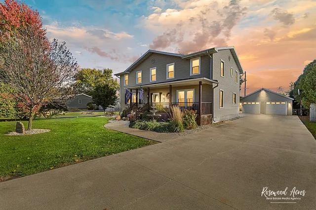 a view of a house with swimming pool yard and outdoor seating