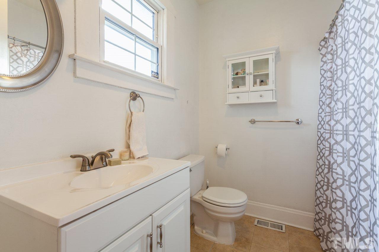 500 Frank Street Raleigh, NC 27604 - Photo 13 of 23 a bathroom with a sink toilet and a mirror