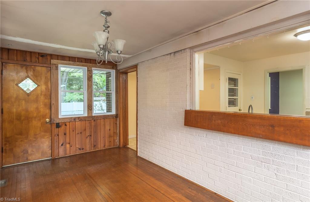 308 Melbourne Road Greensboro, NC 27405 - Photo 11 of 22 pass through window in sunroom