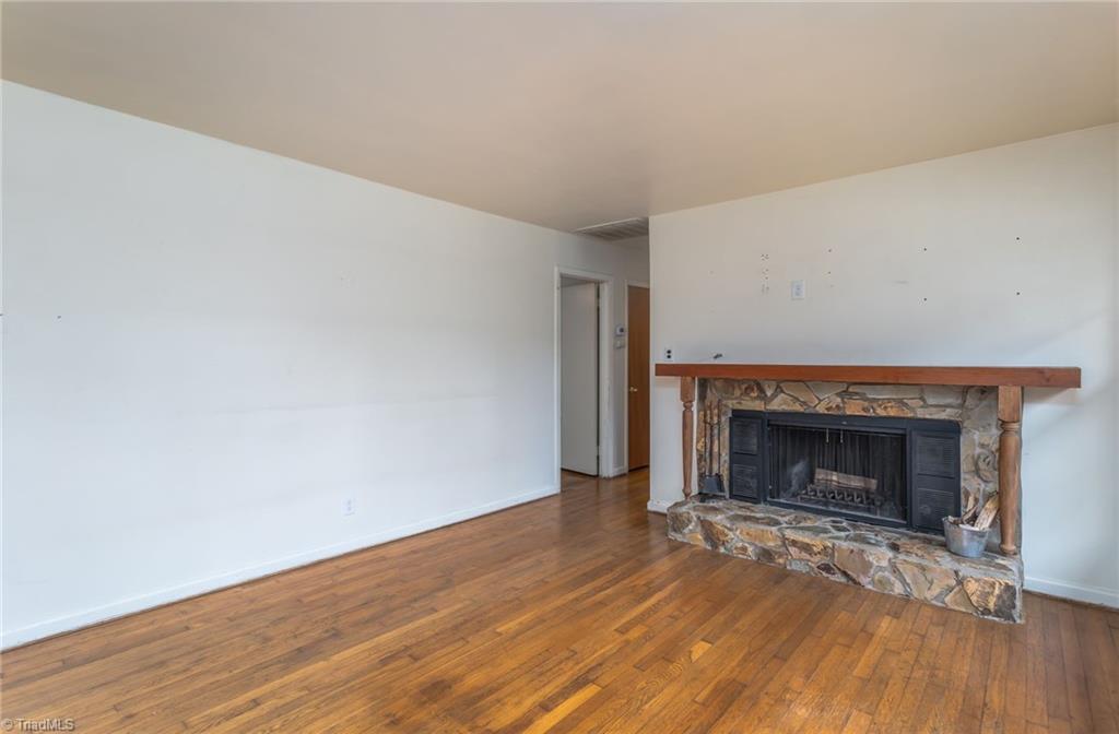 308 Melbourne Road Greensboro, NC 27405 - Photo 6 of 22 Inviting fireplace in living room