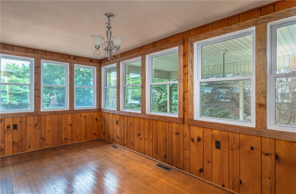 308 Melbourne Road Greensboro, NC 27405 - Photo 10 of 22 Relaxing sunporch off living room