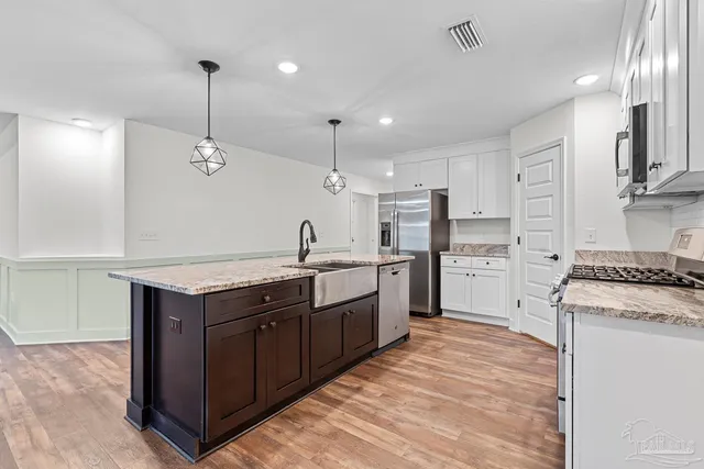 a living room with fireplace furniture and a flat screen tv