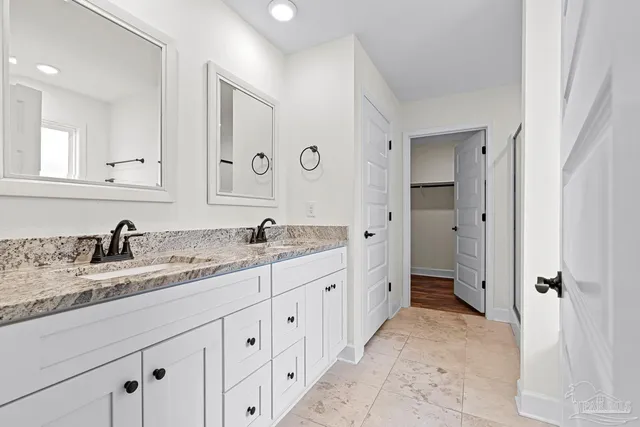 a view of a house with a yard and porch