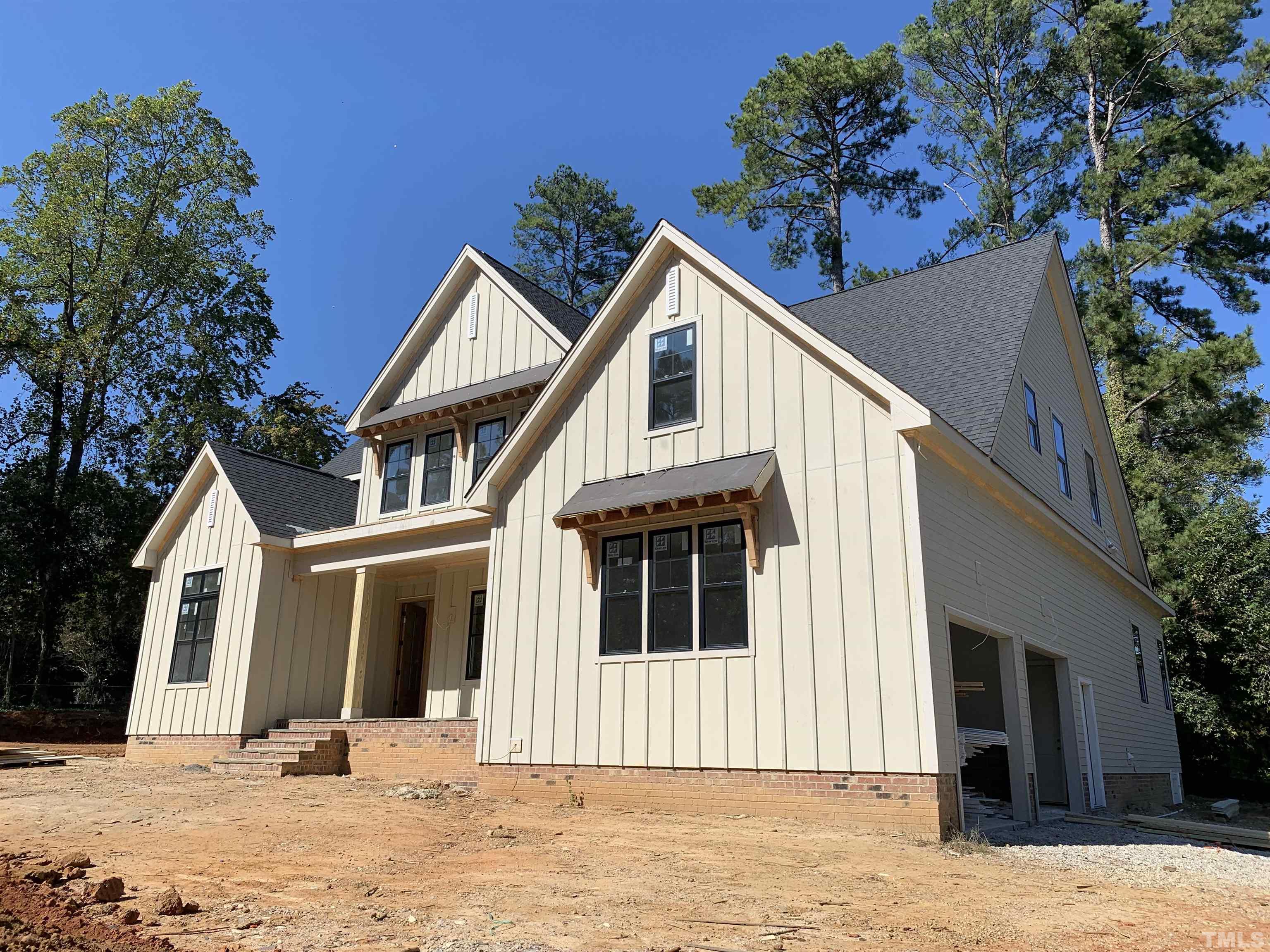 315 Dartmouth Road Raleigh, NC 27609 - Photo 22 of 24 a front view of a house with a yard