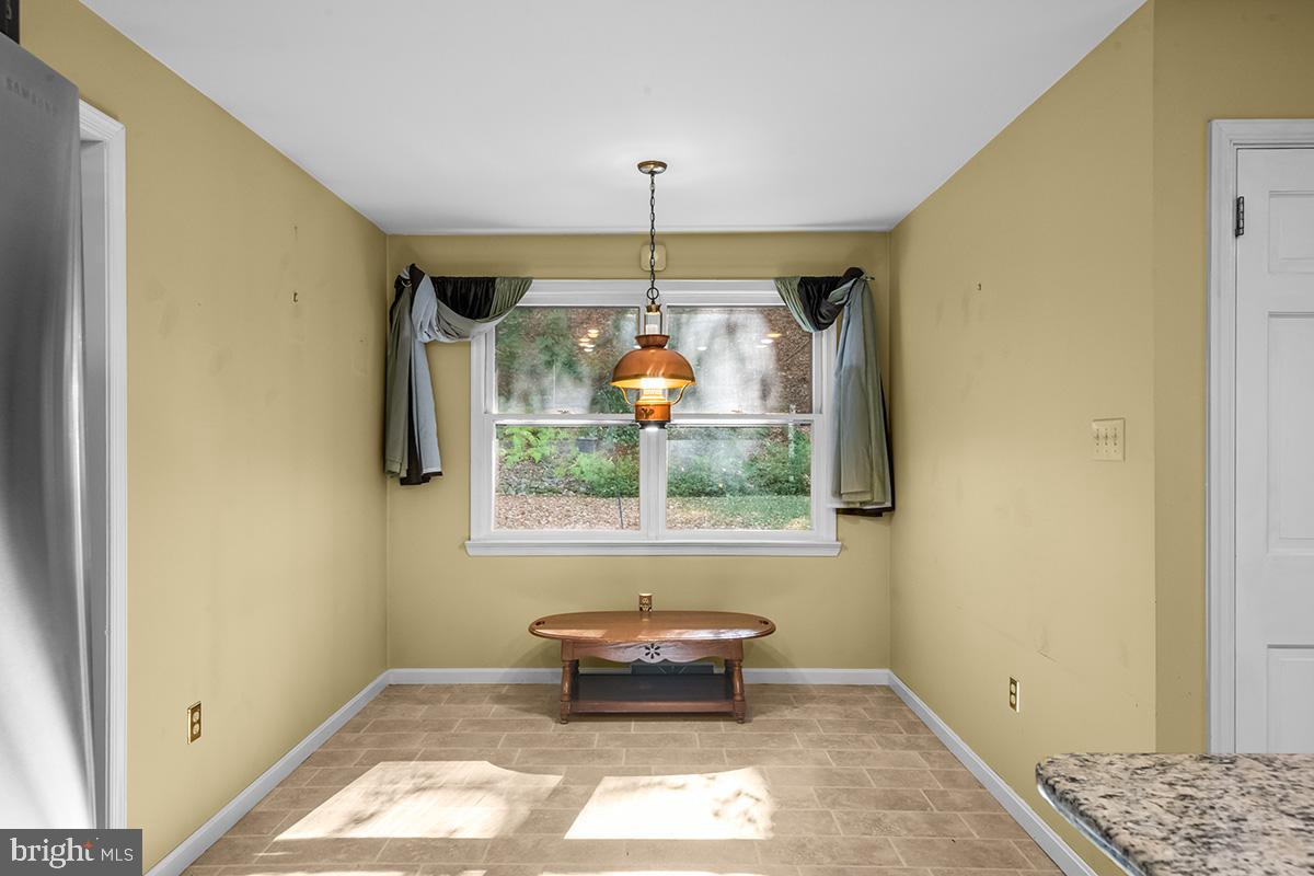 310 4th Street Reading, PA 19607 - Photo 18 of 44 a room with window and stairs