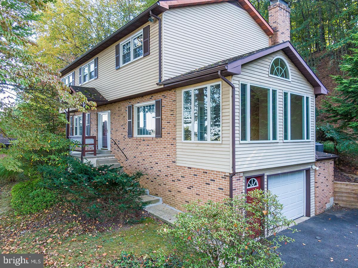 310 4th Street Reading, PA 19607 - Photo 2 of 44 a front view of a house with garden