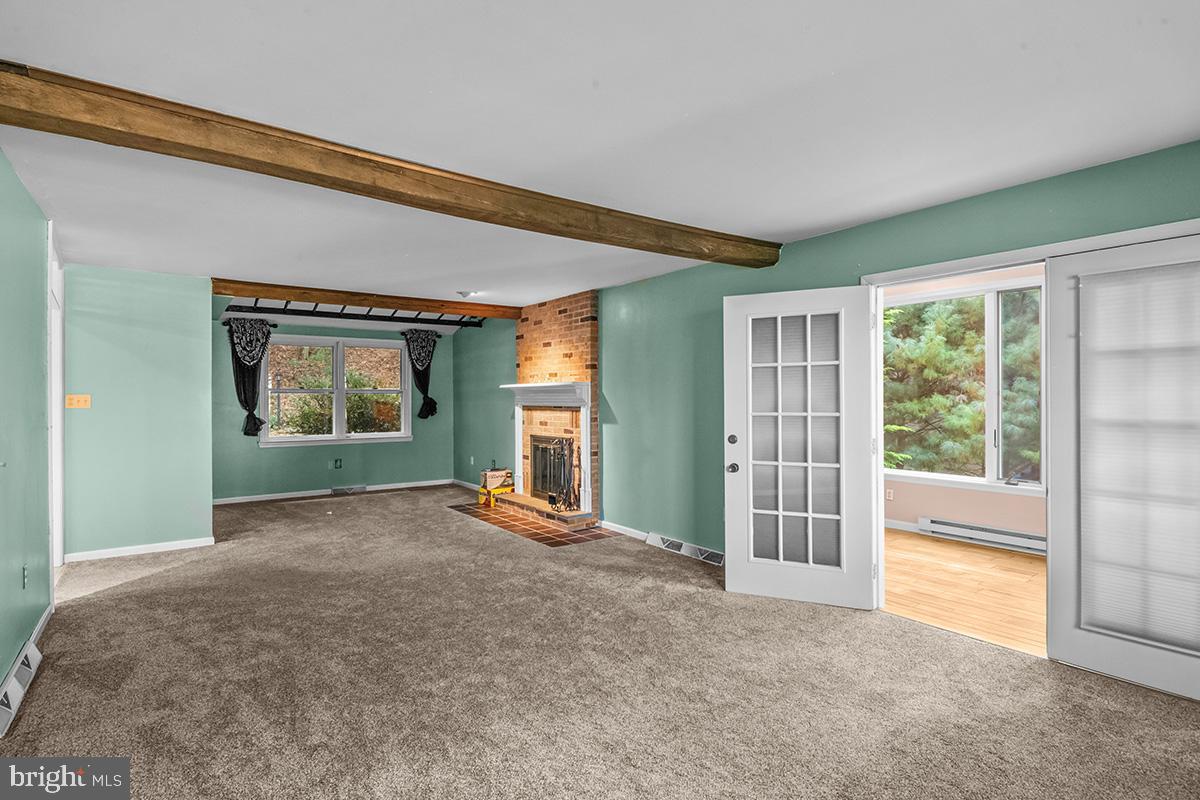 310 4th Street Reading, PA 19607 - Photo 23 of 44 a view of an empty room with a fireplace and a window