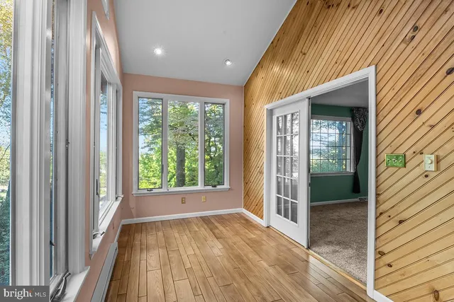 a view of a room with wooden floor and balcony