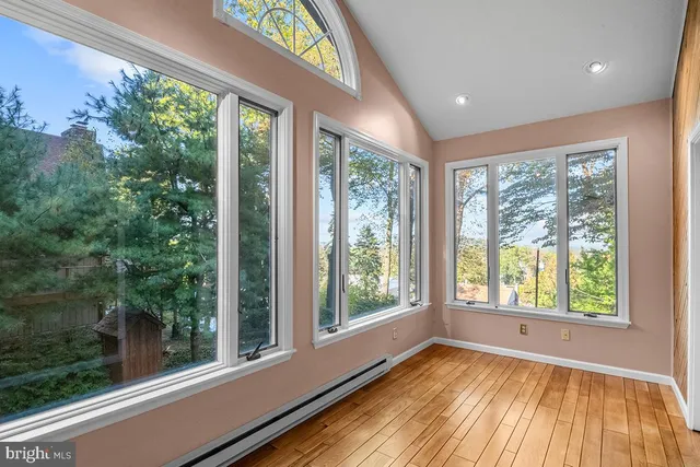 a view of empty room with large windows