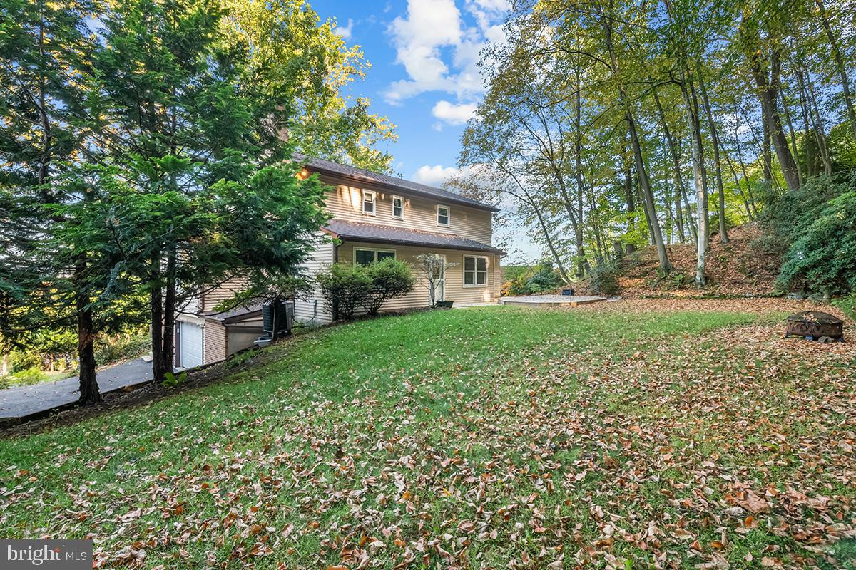 310 4th Street Reading, PA 19607 - Photo 3 of 44 a view of a house with a yard and tree s