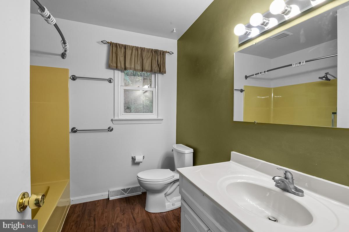 310 4th Street Reading, PA 19607 - Photo 34 of 44 a bathroom with a sink and a mirror