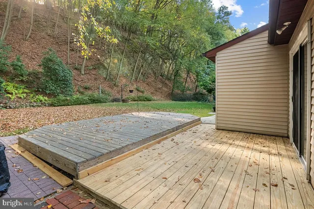 a wooden bench sitting on top of a wooden floor