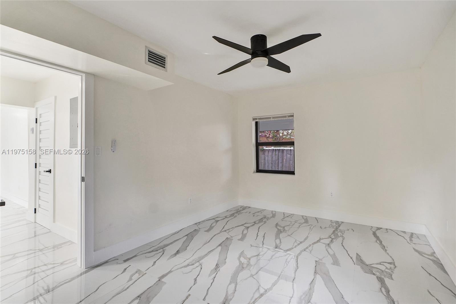 237 Northeast 110th Terrace, Unit 237 Miami, FL 33161 - Photo 8 of 12 wooden floor in an empty room