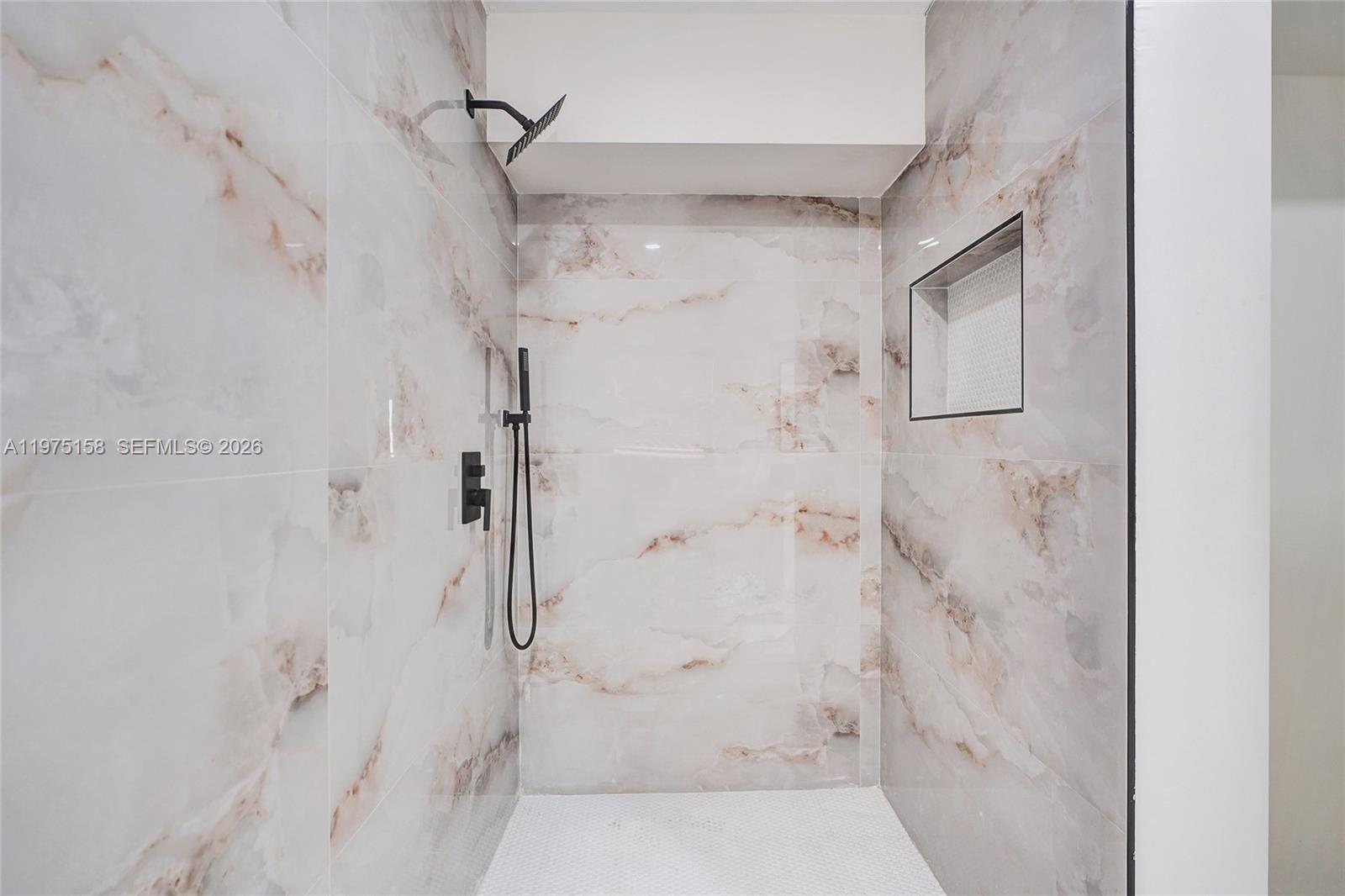 237 Northeast 110th Terrace, Unit 237 Miami, FL 33161 - Photo 9 of 12 a bathroom with a shower