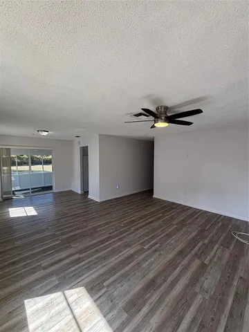 a view of a room with wooden floor