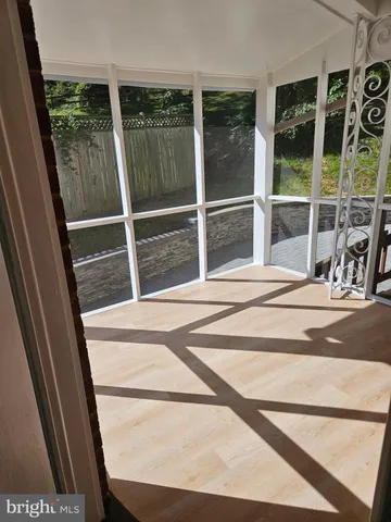 a view of a door and a window