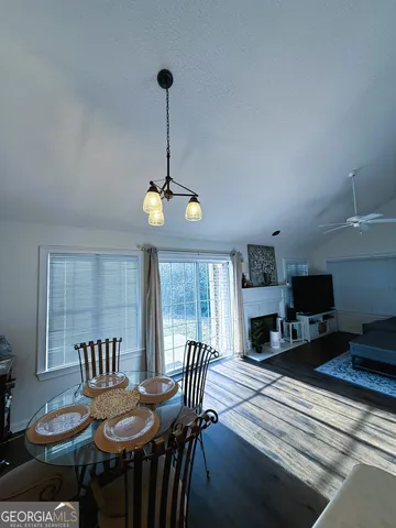 a kitchen with stainless steel appliances a sink a stove a refrigerator cabinets and a counter top space