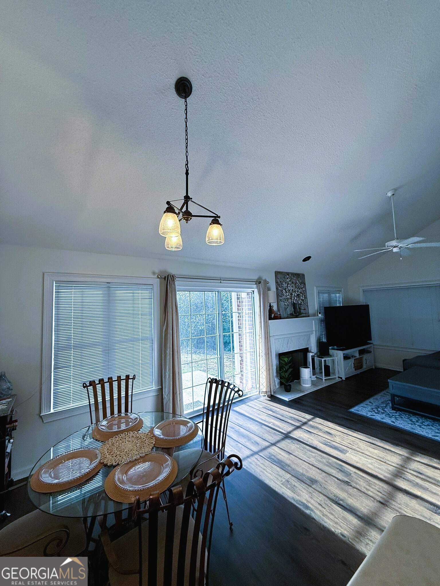 1910 North Loop Road, Unit 6B Vidalia, GA 30474 - Photo 16 of 39 a view of a dining room with furniture a chandelier and wooden floor