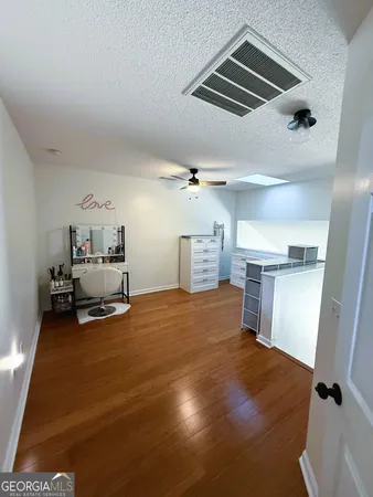 a room with furniture and a ceiling fan