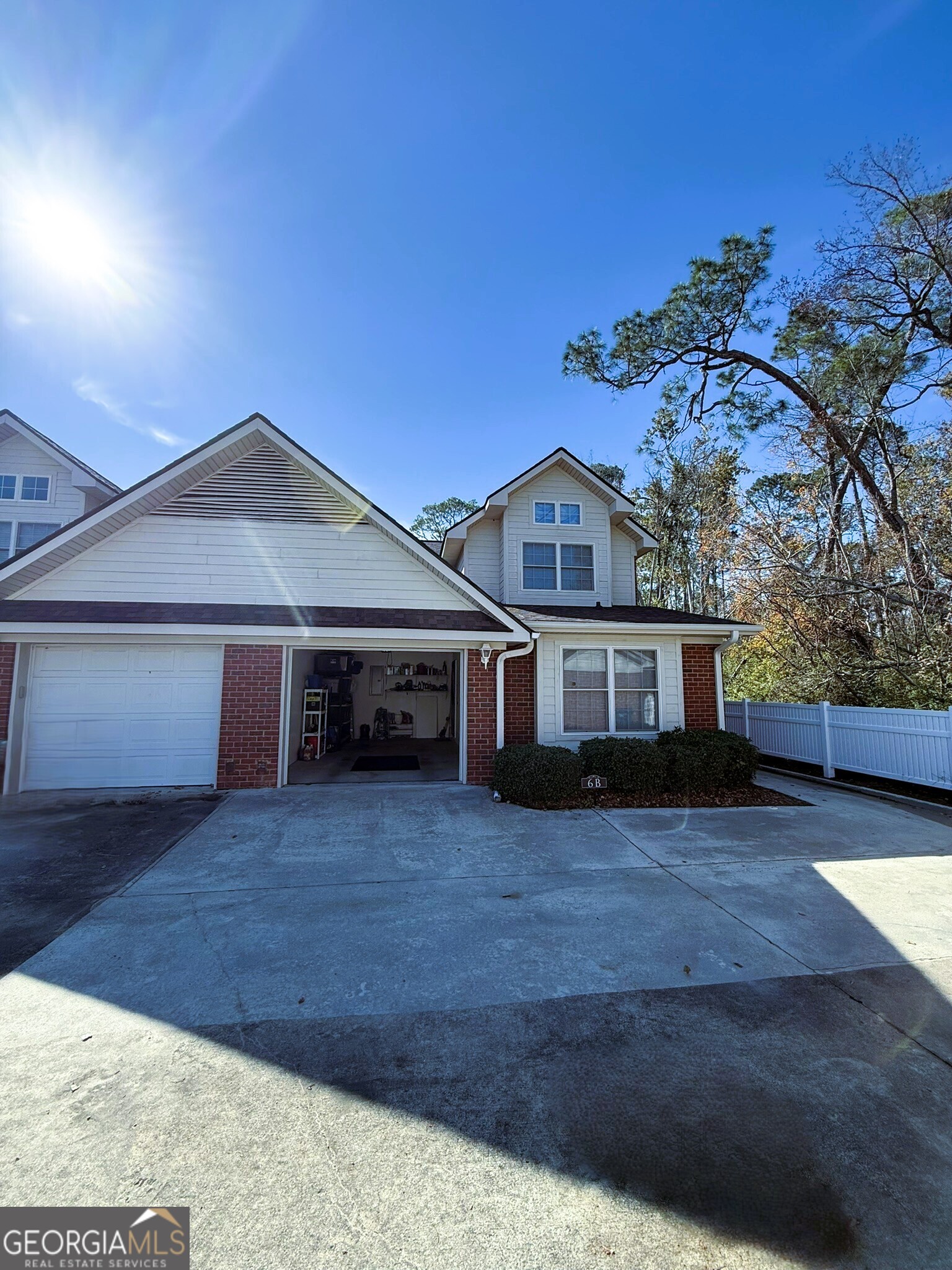 1910 North Loop Road, Unit 6B Vidalia, GA 30474 - Photo 8 of 39 a front view of house with yard and trees in the background