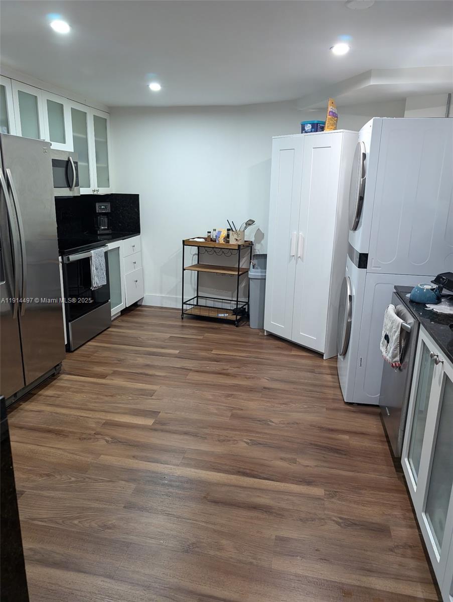 1881 Washington Avenue, Unit 4A Miami Beach, FL 33139 - Photo 4 of 15 a room with furniture and a flat screen tv