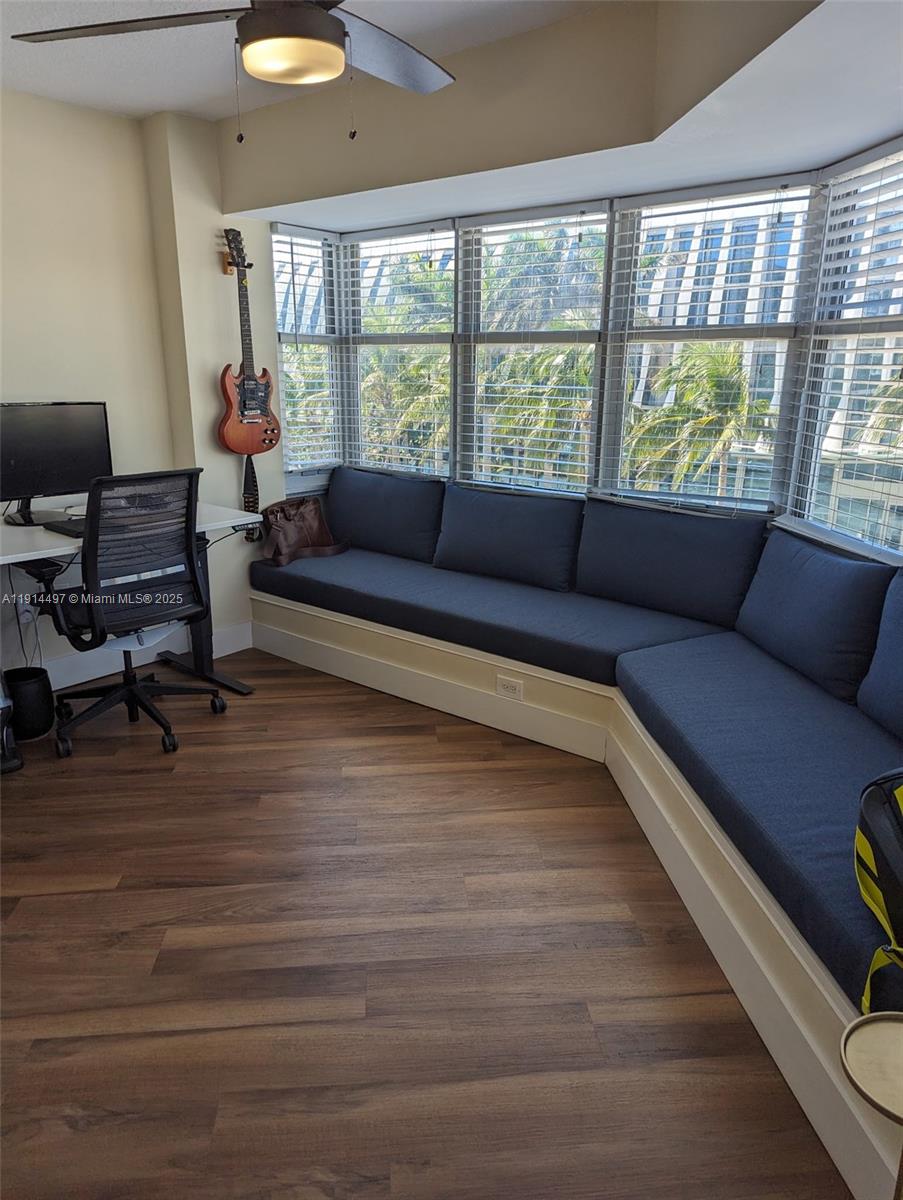 1881 Washington Avenue, Unit 4A Miami Beach, FL 33139 - Photo 7 of 15 a living room with furniture and a large window
