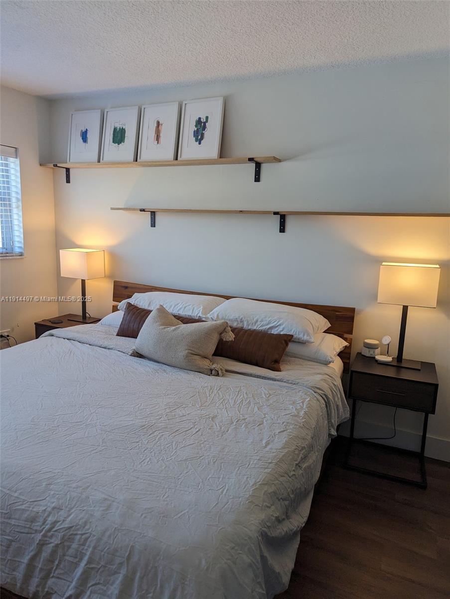 1881 Washington Avenue, Unit 4A Miami Beach, FL 33139 - Photo 8 of 15 a bedroom with bed and window