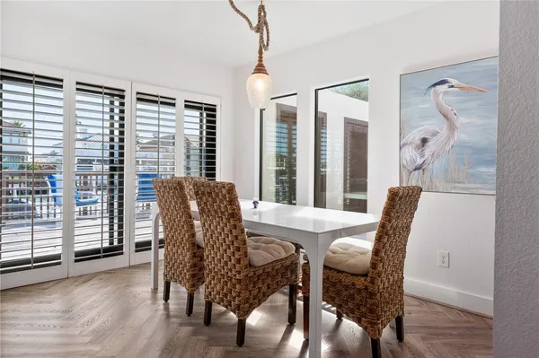 a view of a dining room with furniture and windows