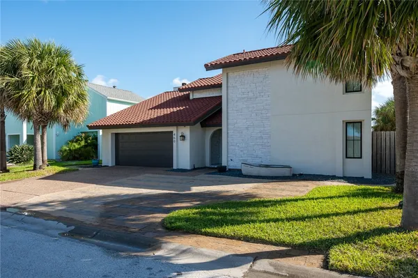 a front view of house with yard and green space