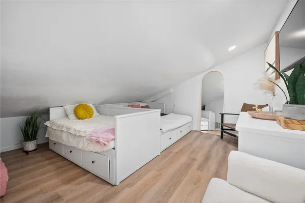 a bed room with a bed window and couch