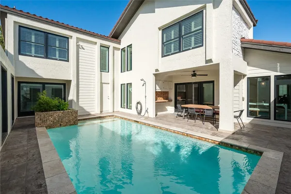 a view of a house with patio and a yard
