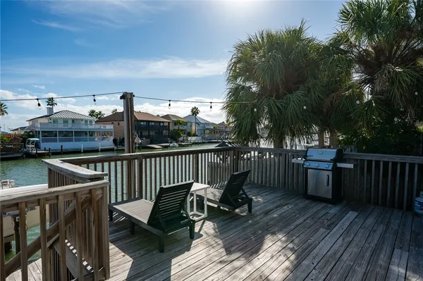 a view of balcony with furniture