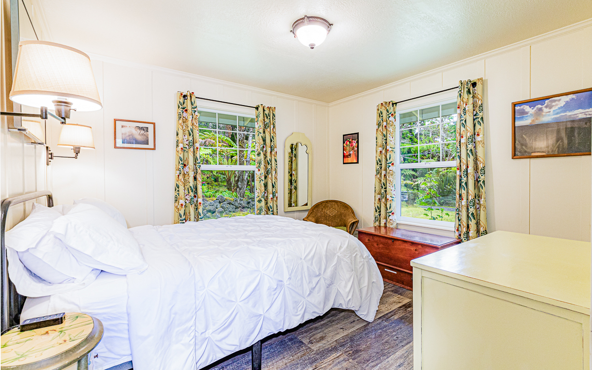19-4029 Kilauea Road Volcano, HI 96785 - Photo 26 of 30 a bed sitting in a bedroom next to a window