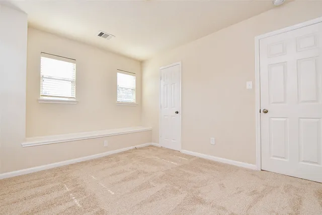 an empty room with windows