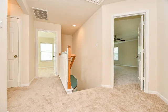 a view of a room with a hallway