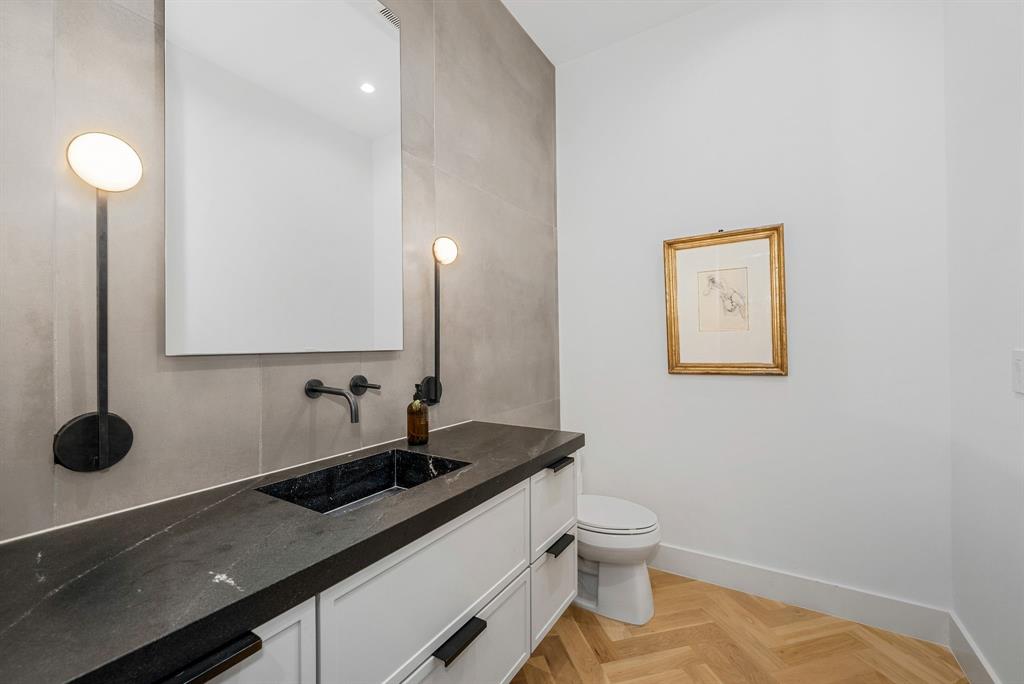 4214 Hawthorne Avenue Dallas, TX 75219 - Photo 12 of 39 a bathroom with a sink and a toilet