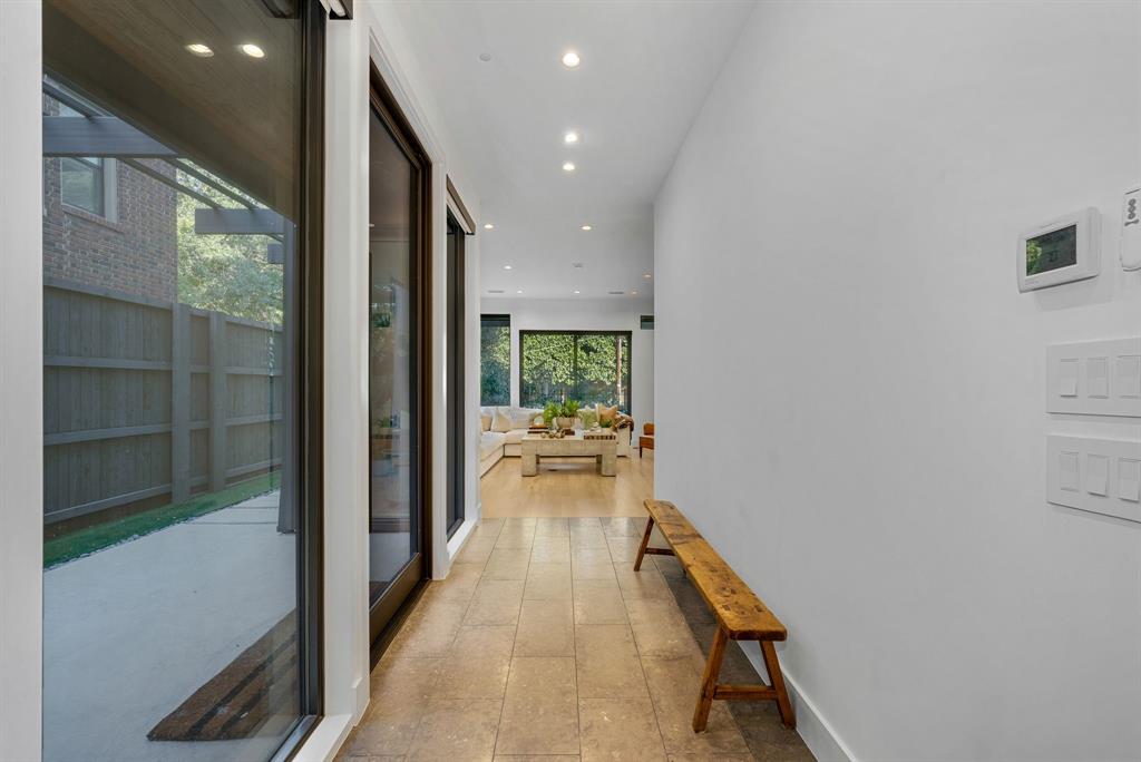 4214 Hawthorne Avenue Dallas, TX 75219 - Photo 13 of 39 a view of a hallway and a livingroom with furniture