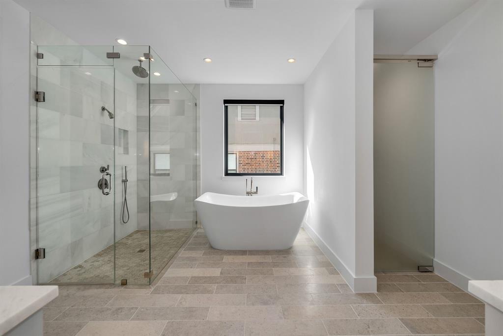 4214 Hawthorne Avenue Dallas, TX 75219 - Photo 18 of 39 a bathroom with a bathtub and shower